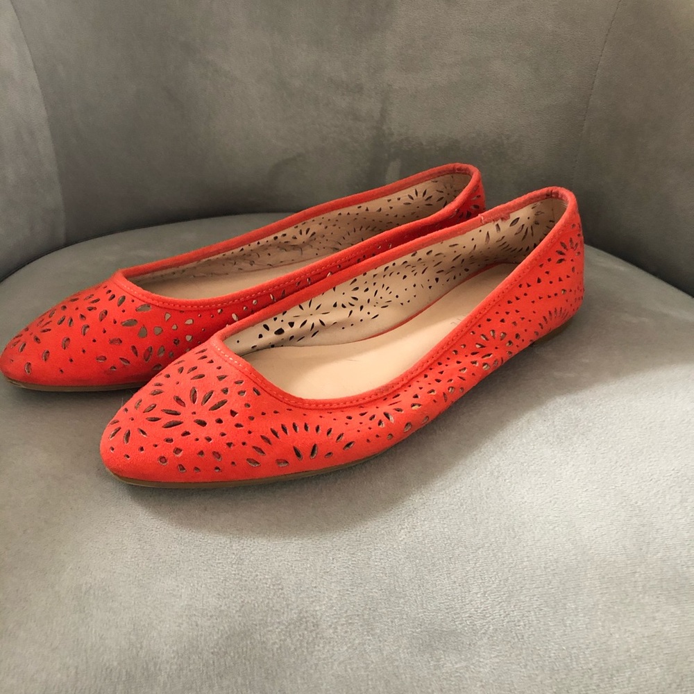 Bright red flats with eyelet detail